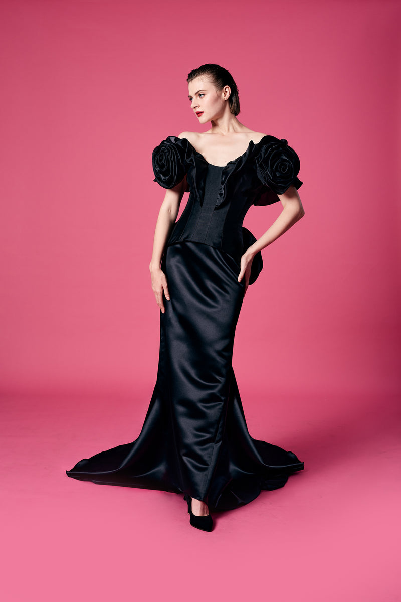 23.	Appliquéd with an oversized organza rose top with Bias cut skirt